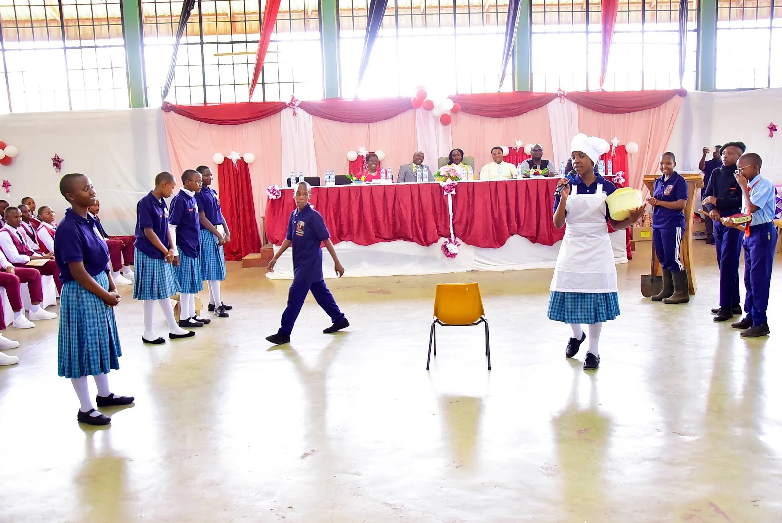 Students performing a scene at the 2025 graduation celebration